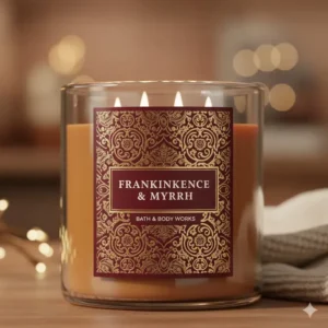 Close-up of the label on a frankincense and myrrh candle bath and body works jar, showcasing its design and product name clearly.