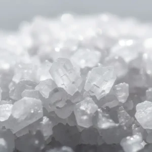 A macro close-up of pure Epsom salt crystals (magnesium sulfate), a key mineral ingredient in effective therapeutic bath salts.