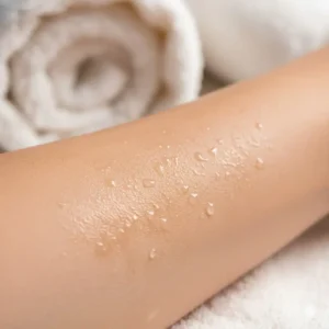 Close-up of smooth, glowing skin after using a deeply hydrating and nourishing scented bath oil.